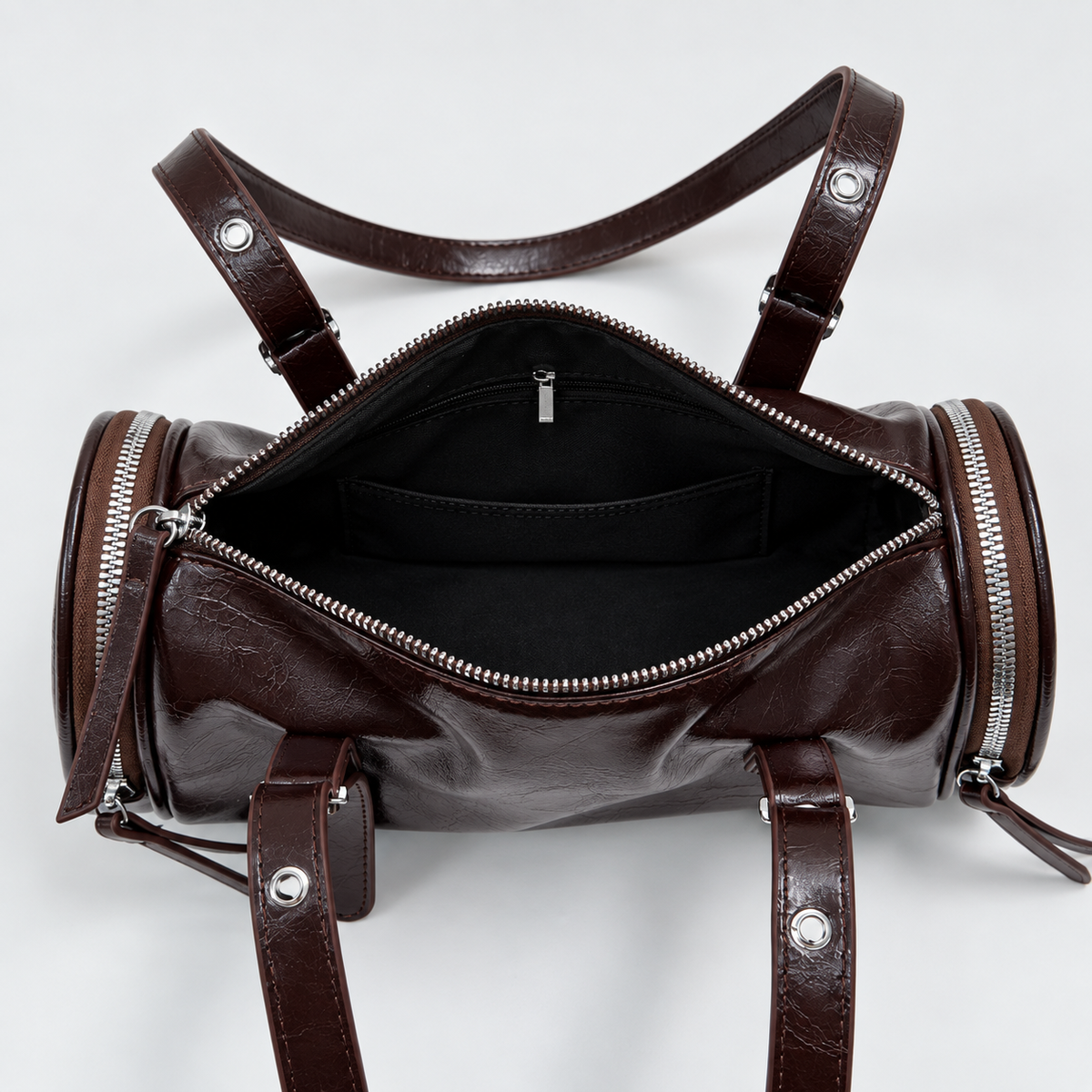 Barrel Shoulder Bag with Sleek Zippers and Buckle Accents