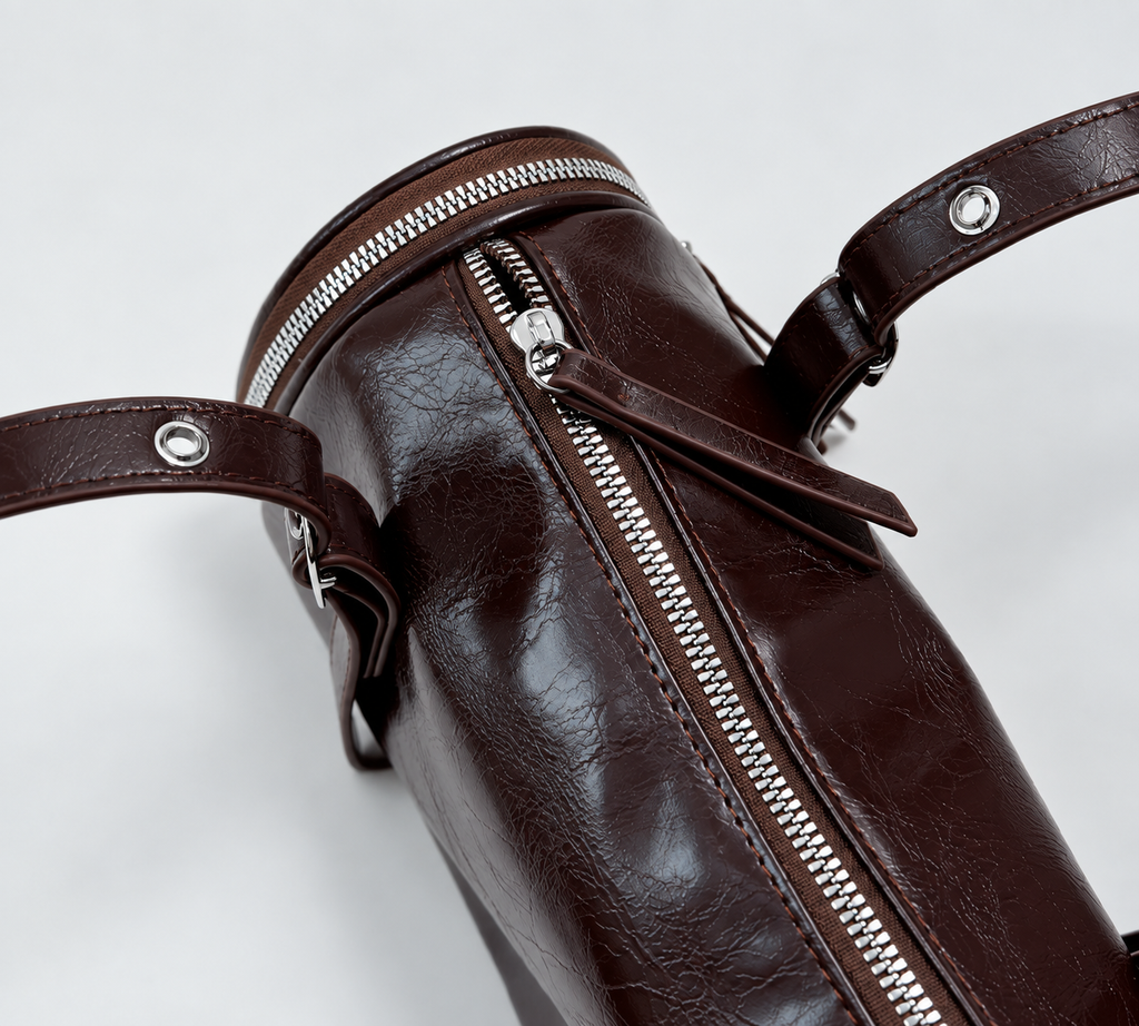 Barrel Shoulder Bag with Sleek Zippers and Buckle Accents