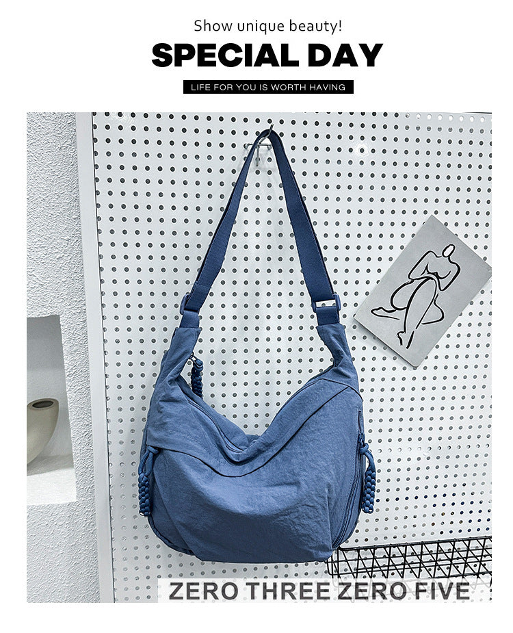 Textured Nylon Dumpling Crossbody Bag