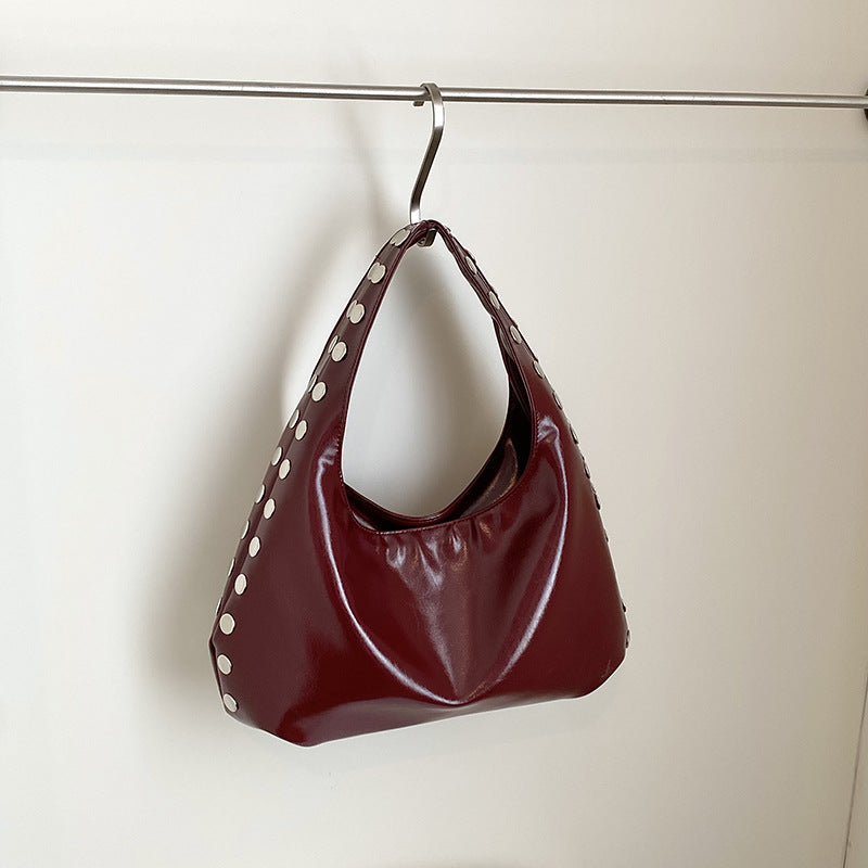 Glossy Hobo Shoulder Bag with Bold Metal Stud Detailing