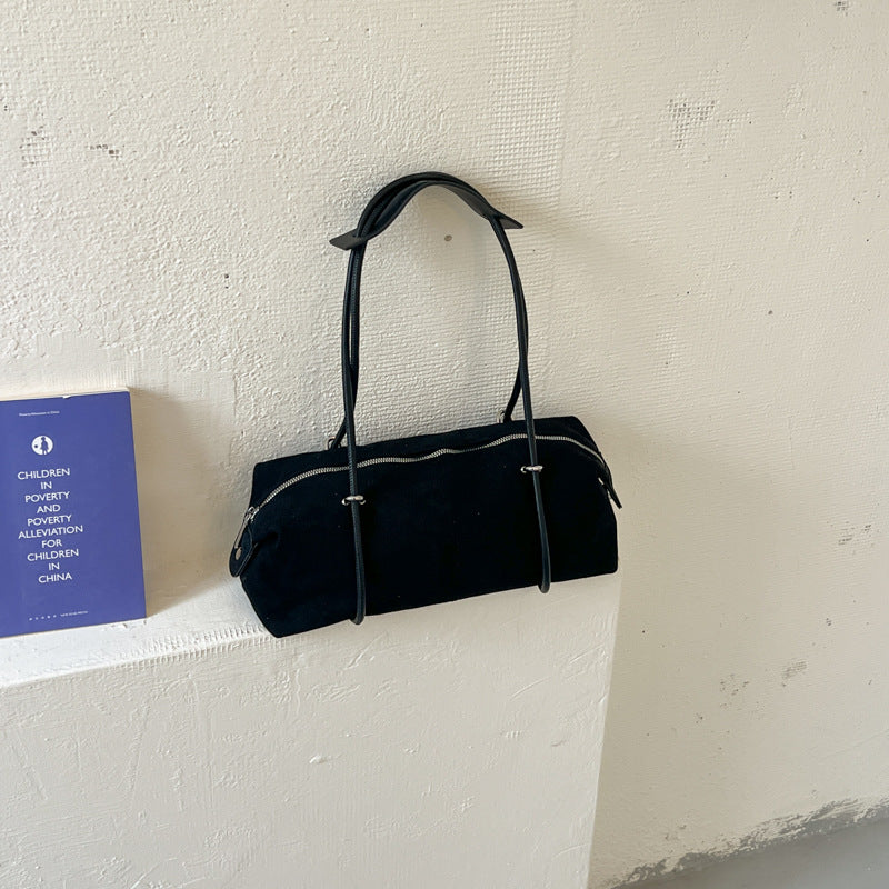 Soft Suede Barrel Shoulder Bag with Metal Accents and Zip Closure
