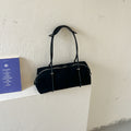 Soft Suede Barrel Shoulder Bag with Metal Accents and Zip Closure
