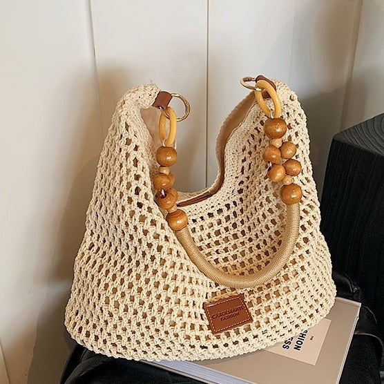 Seaside Vacation Beach Woven Bag For Women 2026 New Hollow Knitted Handbag Large Capacity Single Shoulder Armpit Bag