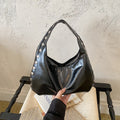 Glossy Hobo Shoulder Bag with Bold Metal Stud Detailing