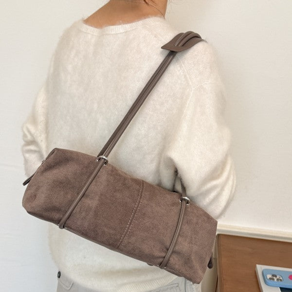 Soft Suede Barrel Shoulder Bag with Metal Accents and Zip Closure
