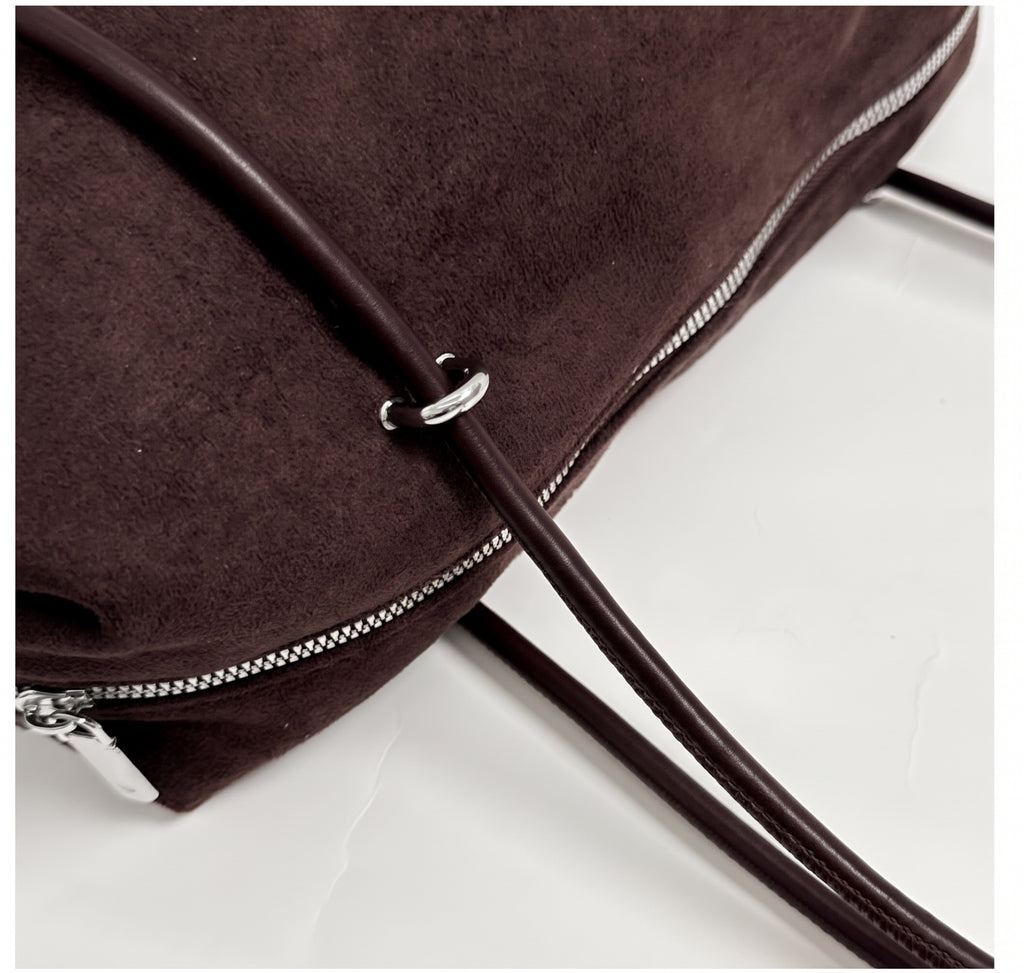 Soft Suede Barrel Shoulder Bag with Metal Accents and Zip Closure