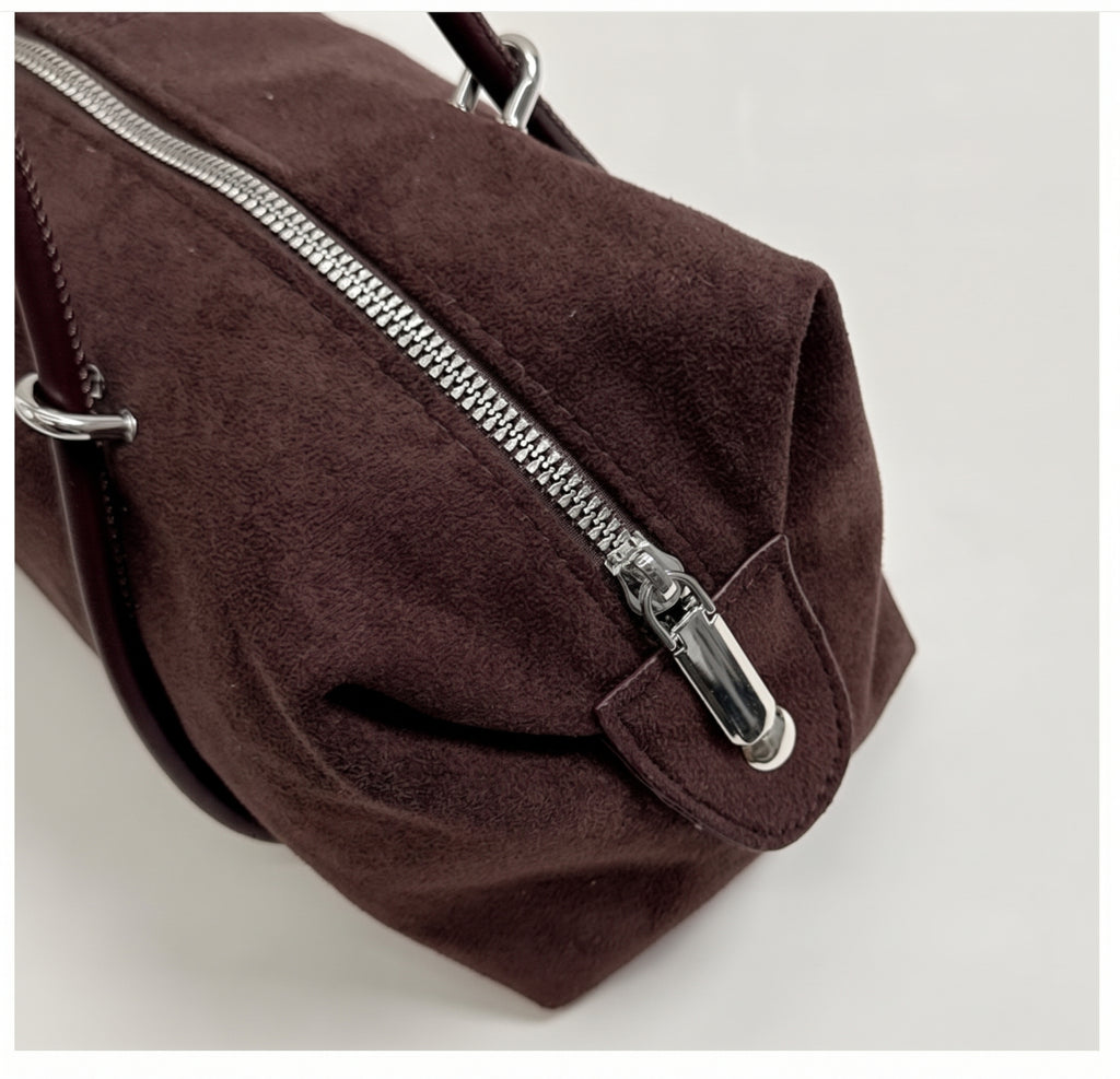 Soft Suede Barrel Shoulder Bag with Metal Accents and Zip Closure