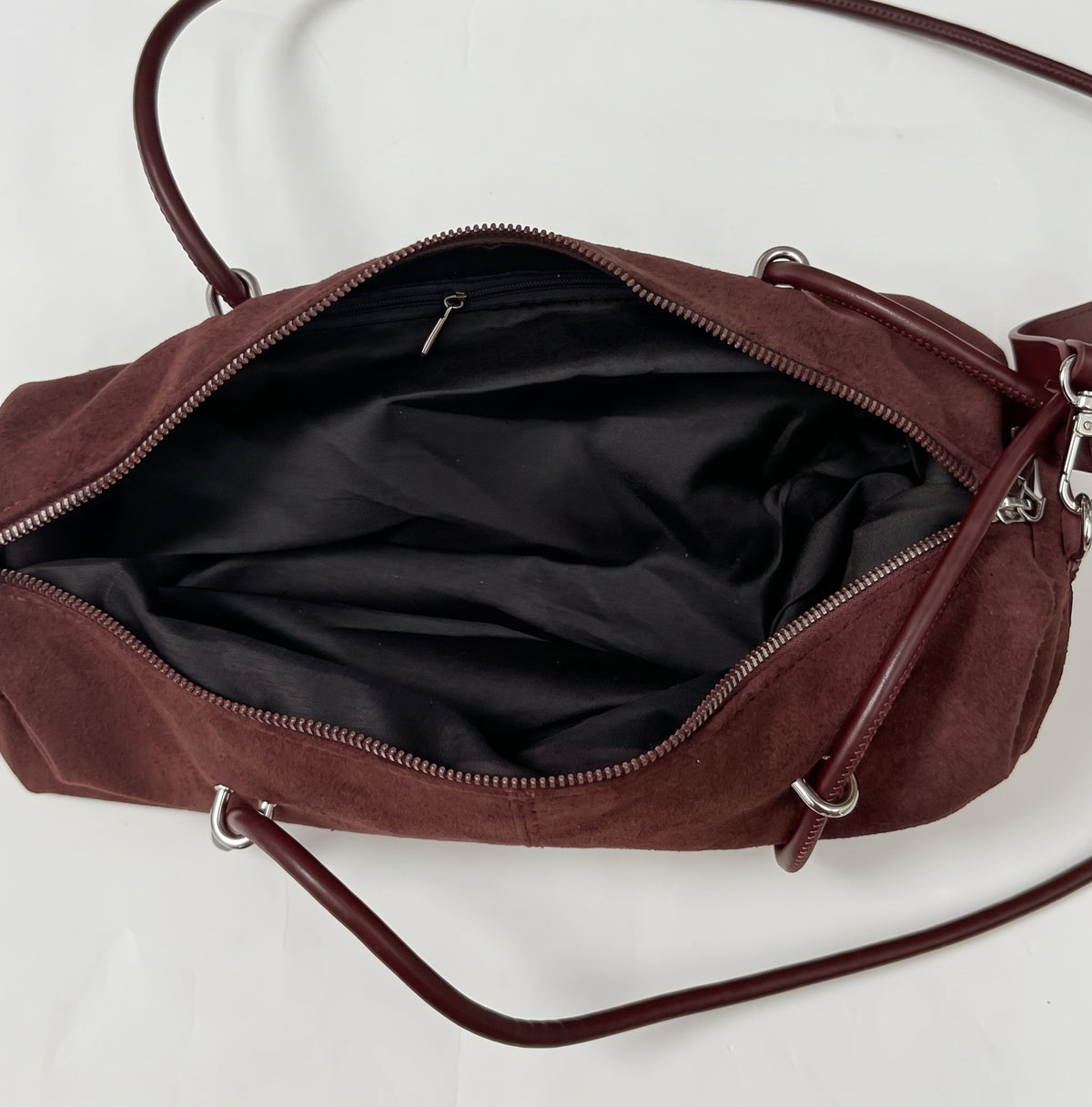 Soft Suede Barrel Shoulder Bag with Metal Accents and Zip Closure